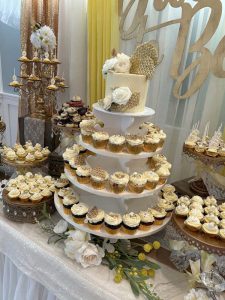 A whole tower of lovely cupcakes and cakes